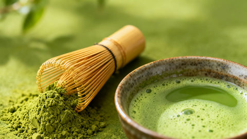 Matcha powder and a bowl of green tea.